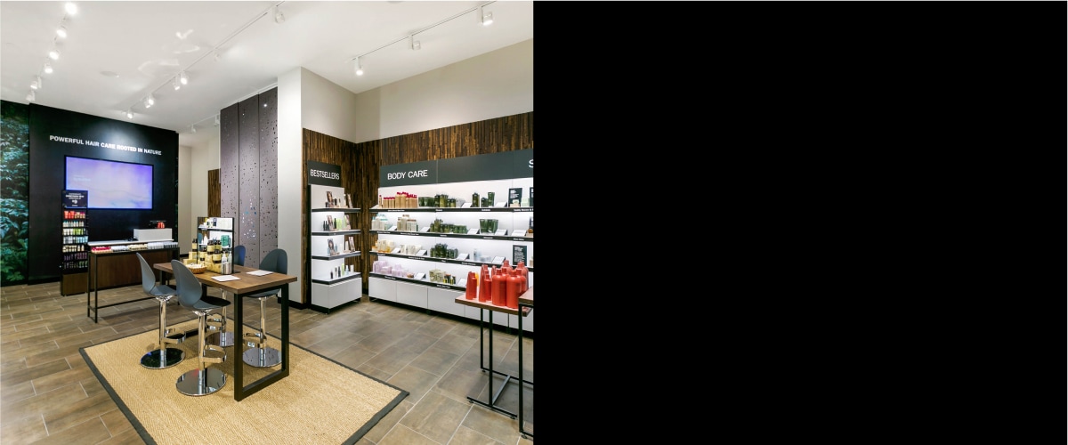 image of interior of Aveda retail store on left and black rectangle on right
